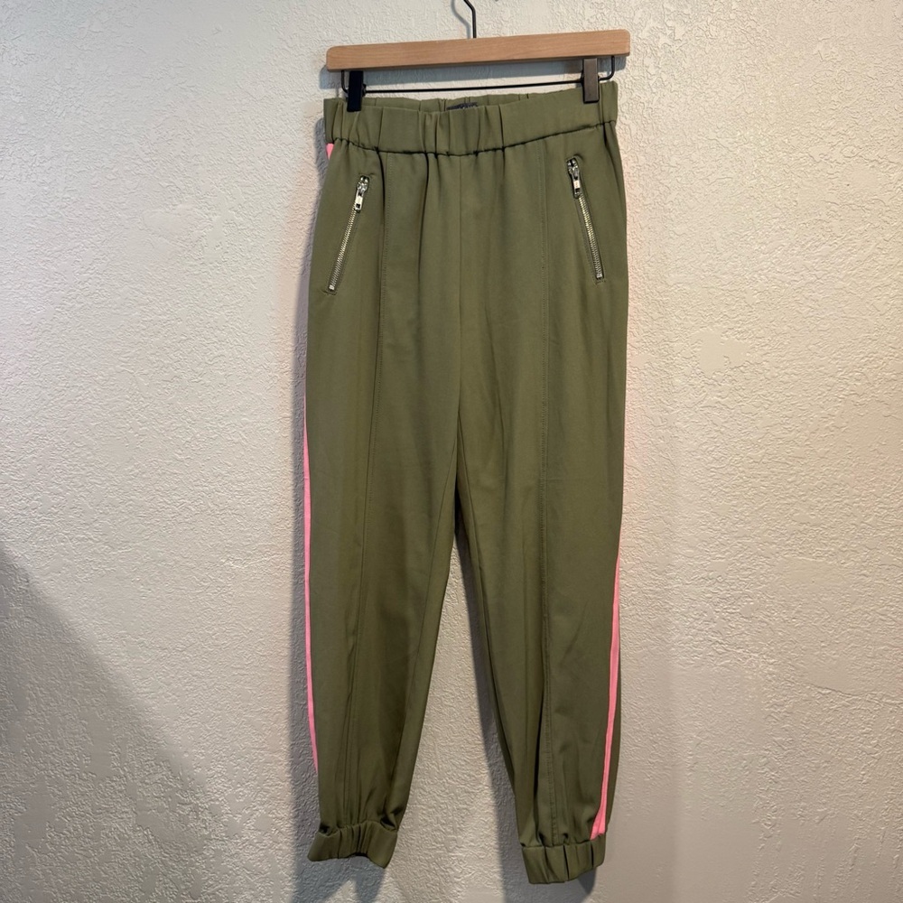 Guess women's olive green joggers with a hot pink stripe down the side Size S